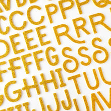 Load image into Gallery viewer, American Crafts - Thickers Stickers - 141/Pkg - Alpha Gold Glitter - April & Ivy. Introducing April and Ivy by American Crafts- a paper collection that effortlessly combines vintage allure, eclectic flair, and vibrant energy. Available at Embellish Away located in Bowmanville Ontario Canada.