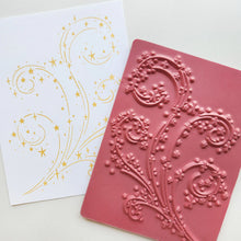 Load image into Gallery viewer, Catherine Pooler - Background Stamp - It's Magic. Inspired by the beloved Swirling Snow and Blowing Leaves designs, this stamp features a captivating swirl of dazzling stars that will bring a touch of Christmas magic to your cards. Available at Embellish Away located in Bowmanville Ontario Canada.