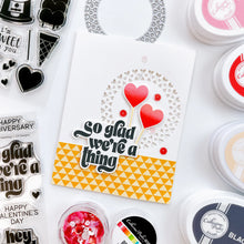 Load image into Gallery viewer, Catherine Pooler - Die - Heartthrob. Create the perfect focal point for your card with the Heartthrob Die. This die cuts out a circle pattern of hearts from your card layer which makes the perfect spot for your sentiments and image stamps. Available at Embellish Away located in Bowmanville Ontario Canada. Example by brand ambassador.