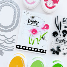 Load image into Gallery viewer, Catherine Pooler - Dies - Scalloped Loop. Create the perfect centerpiece for your card with the Scalloped Loop Dies. This set of frame edge dies, cuts a beautiful scalloped pattern from your card front in two sizes. Available at Embellish Away located in Bowmanville Ontario Canada. Example by brand ambassador.