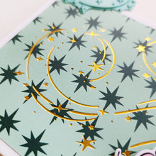 Load image into Gallery viewer, Catherine Pooler - Hot Foil Plates - It's Magic. Bring a touch of holiday enchantment to your projects. Inspired by swirling snow and blowing leaves, this plate features a mesmerizing swirl of dazzling stars that adds Christmas magic to your cards. Available at Embellish Away located in Bowmanville Ontario Canada.