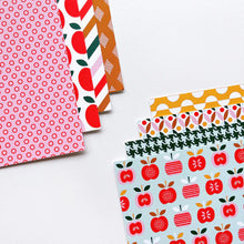 Load image into Gallery viewer, Catherine Pooler - Patterned Paper - Bushel and a Peck. I love this paper....a bushel and a peck! The Bushel and a Peck Patterned Paper features a fun and modern mix of apple prints and fun patterns. Available at Embellish Away located in Bowmanville Ontario Canada.