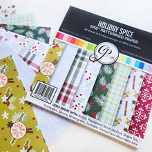 Load image into Gallery viewer, Catherine Pooler - Patterned Paper - Holiday Spice. Add a touch of festive flair to your projects. This traditional mix of patterns and prints showcases abundant holiday floral and greenery, all in a classic Spa Color combo. Available at Embellish Away located in Bowmanville Ontario Canada.