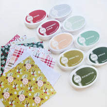 Load image into Gallery viewer, Catherine Pooler - Patterned Paper - Holiday Spice. Add a touch of festive flair to your projects. This traditional mix of patterns and prints showcases abundant holiday floral and greenery, all in a classic Spa Color combo. Available at Embellish Away located in Bowmanville Ontario Canada.