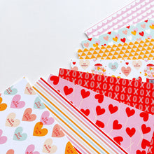 Load image into Gallery viewer, Catherine Pooler - Patterned Paper - Sweethearts. The perfect valentine needs the perfect patterned paper and Sweethearts Patterned Paper is it! Have the Cutest V'day Ever with this mix of patterns and prints with a love heart and sweet treats theme! Available at Embellish Away located in Bowmanville Ontario Canada.