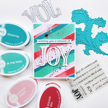 Load image into Gallery viewer, Catherine Pooler - Sentiment Stamps - Holiday Joy. Designed to pair beautifully with the Festive Joy Word Die, it’s ideal for sending peace, love, and joy this season. Make your festive messages shine with this essential sentiment set! Available at Embellish Away located in Bowmanville Ontario Canada. Example by Catherine Pooler Designs.
