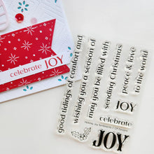 Load image into Gallery viewer, Catherine Pooler - Sentiment Stamps - Holiday Joy. Designed to pair beautifully with the Festive Joy Word Die, it’s ideal for sending peace, love, and joy this season. Make your festive messages shine with this essential sentiment set! Available at Embellish Away located in Bowmanville Ontario Canada.