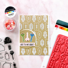 Load image into Gallery viewer, Catherine Pooler - Background Stamp - Lots of Locks. Create a vintage lock background with the Lots of Locks Background Stamp! This repeating pattern will make a great layer for your card inked up in a variety of colors. Available at Embellish Away located in Bowmanville Ontario Canada. Example by brand ambassador.