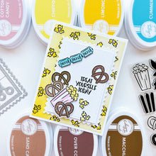 Load image into Gallery viewer, Catherine Pooler - Stamp & Die Set - Admit Two. The Admit Two Stamp Set and Dies features all the yummy fair classics like cotton candy and soft pretzels. It also has other festive elements like a pinwheel and the first place ribbon. Available at Embellish Away located in Bowmanville Ontario Canada. Example by brand ambassador.