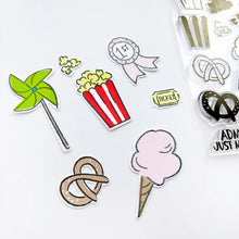 Load image into Gallery viewer, Catherine Pooler - Stamp & Die Set - Admit Two. The Admit Two Stamp Set and Dies features all the yummy fair classics like cotton candy and soft pretzels. It also has other festive elements like a pinwheel and the first place ribbon. Available at Embellish Away located in Bowmanville Ontario Canada.