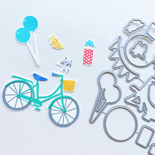 Load image into Gallery viewer, Catherine Pooler - Stamp & Die Set - Pedaling By. Featuring a birthday bike with tons of fun decorations. Decorate with the gifts, balloons and bunting. There's also a basket that can be filled with flowers or a kitty to take along or the ride! Available at Embellish Away located in Bowmanville Ontario Canada.