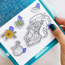 Load image into Gallery viewer, Catherine Pooler - Stamp & Die Set - Pumpkin Pick-Up. Straight from the farm, this Set is the quintessential fall image! Color in this large line art image of a vintage truck filled to the brim with hay, sunflowers and of course- the pumpkins! Available at Embellish Away located in Bowmanville Ontario Canada. Example by brand ambassador.