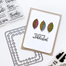 Load image into Gallery viewer, Catherine Pooler - Stamp & Die Set - Stamp-a-Side Leaves. You will certainly fall for the Stamp-a-Side Leaves Stamp & Die Set. You can stamp the whimsical patterned leaves with multiple ink colors or color the outline image with markers or blender pens. Available at Embellish Away located in Bowmanville Ontario Canada. Example by brand ambassador.