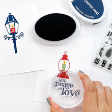 Load image into Gallery viewer, Catherine Pooler - Stamp & Die Set - Warm & Bright. Light glowing works of art, lamps and lanterns are a classic icon of warmth and home. Features these images with candles and greenery to "decorate" them for the winter season. Available at Embellish Away located in Bowmanville Ontario Canada.