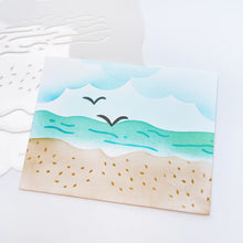 Load image into Gallery viewer, Catherine Pooler - Stencil - Sand & Sea. This smart stencil has four sides cut to use for blending clouds, waves, and the sandy beach edge. Add texture to the water and sand with the inside elements of the stencil. Add pair of seagulls in the distance. Available at Embellish Away located in Bowmanville Ontario Canada.