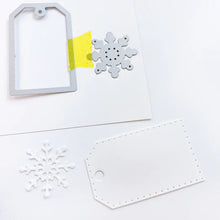 Load image into Gallery viewer, Catherine Pooler - Tag Die - Snowflake. This gift tag features a dotted edge pattern and additional snowflake die. Cut the snowflake from the tag or cut and paste it on for cards, projects and more! Available at Embellish Away located in Bowmanville Ontario Canada. Example by brand ambassador.