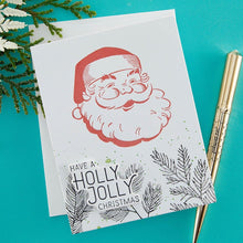 Load image into Gallery viewer, Spellbinders - Better Press Plates & Die Set - Holly Jolly Santa. From the More BetterPress Christmas Collection with two press plates of a sweet and jolly Santa face and the perfect sentiment makes a great pair! Available at Embellish Away located in Bowmanville Ontario Canada. Example by brand ambassador.