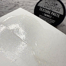 Load image into Gallery viewer, Tim Holtz - Distress Texture Paste - 3oz - Twinkle. Add texture and sparkle to Winter Holiday creations. At Embellish Away in Bowmanville Ontario Canada.