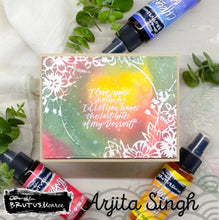 Load image into Gallery viewer, Brutus Monroe - Mixed Media Stencil - Floral Hoop. Made of a high quality plastic that will not wear down with use of a blending tool/sprays/inking. Designs can be used with large format pieces as well as small cards and the pattern will not be lost. Available at Embellish Away located in Bowmanville Ontario Canada. Card made by Arjita Singh.