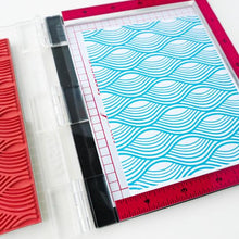 Load image into Gallery viewer, Catherine Pooler - Background Stamp - Making Waves. Create a funky background with the Making Waves Background Stamp. Grab your spa blues like Tranquil and Cove Blue for a natural effect or why not mix in bright and funky colors to add this wavy print to any festive card. This one will be fun for nautical cards and beyond! Available at Embellish Away located in Bowmanville Ontario Canada.
