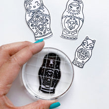 Load image into Gallery viewer, Catherine Pooler - Die Set - We Fit. Remind your friends and loved ones they "just fit" by sending cards made with the We Fit Dies and coordinating We Fit Stamps. Use the dies to cut out one of the three dolls, the cat doll or one of the extras. Layer the pieces to create dimension and fun on all your friendly cards. Available at Embellish Away located in Bowmanville Ontario Canada.