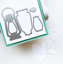 Load image into Gallery viewer, Catherine Pooler - Dies - Camping Lantern. The Summer Nights Collection would be incomplete without a classic Camping Lantern! This die will be great for projects and scrapbook pages as well as light up cards!! Available at Embellish Away located in Bowmanville Ontario Canada.