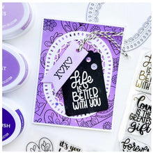 Load image into Gallery viewer, Catherine Pooler - Dies - Fancy Loop. The Fancy Loop Die is a beautiful scalloped frame die. This straight sided oval or "loop" die is a great shape for a standard A2 card front as a feature frame or popped up element. Available at Embellish Away located in Bowmanville Ontario Canada. Example by brand ambassador.