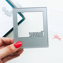 Load image into Gallery viewer, Catherine Pooler - Dies - Instant Thanks. Inspired by the classic Polaroid are the Instant Happy and Instant Thanks Dies. These versatile dies can be used in so many ways! With the secondary dies, you can cut the word out of the frame for another look. Illustrated by Leslie Dunegan. Stainless steel and are compatible with all standard die cutting machines. Available at Embellish Away located in Bowmanville Ontario Canada.