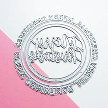 Load image into Gallery viewer, Catherine Pooler - Dies - Round of Merry. Let's have a round of merry, this holiday season with the Round of Merry Dies. This pair of nesting "Merry Christmas" word dies does double duty in creating both a sentiment and shape element for your Christmas cards. One says "Merry Christmas" around the perimeter and the other has a scripted greeting inside. Available at Embellish Away located in Bowmanville Ontario Canada.