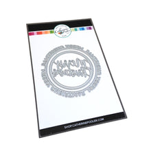 Load image into Gallery viewer, Catherine Pooler - Dies - Round of Merry. Let's have a round of merry, this holiday season with the Round of Merry Dies. This pair of nesting "Merry Christmas" word dies does double duty in creating both a sentiment and shape element for your Christmas cards. One says "Merry Christmas" around the perimeter and the other has a scripted greeting inside. Available at Embellish Away located in Bowmanville Ontario Canada.