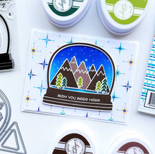 Load image into Gallery viewer, Catherine Pooler - Stamps - Snow Globe Adventure. Where to? Let's take a snow globe adventure! Build the perfect snow globe scene with the Snow Globe Adventure Stamp Set. For more design options, mix in images from the Dream Away Sentiments Stamp Set to make your adventure even more exciting. Available at Embellish Away located in Bowmanville Ontario Canada. Card design by Ambassador.