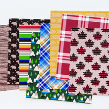 Load image into Gallery viewer, Catherine Pooler - Patterned Paper - Moose Crossing. Oh the beauty of the land and heritage of Canada! The Moose Crossing Patterned Paper celebrates this with patterns including moose, mountains, inuksuks, bears, woodgrain and maple leaves. Available at Embellish Away located in Bowmanville Ontario Canada.