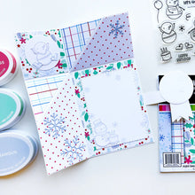 Load image into Gallery viewer, Catherine Pooler - Patterned Paper - Snow Day Birthday. The Snow Day Birthday Patterned Paper combines a frosty color combo with a birthday motif! Snowmen, holly filled florals and party hats are among some of the patterns and prints in this sweet pack. Available at Embellish Away located in Bowmanville Ontario Canada. card example by brand ambassador.