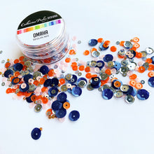 Load image into Gallery viewer, Catherine Pooler - Sequin Mix - Omaha. A modern metropolis nestled in the middle of America's heartland is Omaha, Nebraska. With close access to rivers, lakes and beautiful wooded hikes, this city is bound to attract the "outdoorsy" types which makes it a great match to our Woodsy Patterned paper. Available at Embellish Away located in Bowmanville Ontario Canada.