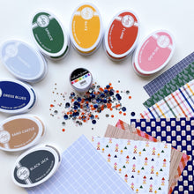 Load image into Gallery viewer, Catherine Pooler - Sequin Mix - Omaha. A modern metropolis nestled in the middle of America's heartland is Omaha, Nebraska. With close access to rivers, lakes and beautiful wooded hikes, this city is bound to attract the "outdoorsy" types which makes it a great match to our Woodsy Patterned paper. Available at Embellish Away located in Bowmanville Ontario Canada.