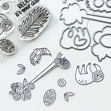 Load image into Gallery viewer, Catherine Pooler - Stamp & Die Set - Jungle Amigos. Send a jungle greeting to your friend and let them know "things are about to get wild"! The Jungle Amigos Set features a happy sloth and his toucan friend who are ready to hang out on your next card. Available at Embellish Away located in Bowmanville Ontario Canada.