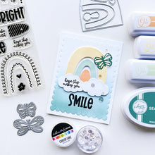 Load image into Gallery viewer, Catherine Pooler - Stamp & Dies Set - Smile Bright. Smile Bright! This 6x8 Stamp Set and coordinating dies are ready for you to piece it together to your hearts content to create a modern, boho rainbow. Available at Embellish Away located in Bowmanville Ontario Canada. Card example by brand ambassador.