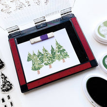 Load image into Gallery viewer, Catherine Pooler - Stamps - Evergreen Woods. Create your own Evergreen Woods with our 6x8 layering stamp set and coordinating Evergreen Woods Dies. This set contains multi-step stamps to "build" a forest of pine trees or an individual tree. The addition of the North Star stamp will bring added warmth to your winter scene or even make a nice holiday tree topper. Available at Embellish Away located in Bowmanville Ontario Canada.