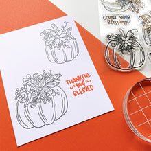 Load image into Gallery viewer, Catherine Pooler - Stamps - Front Porch Pumpkin. If an elegant, farmhouse look is your go-to for Halloween and Fall, then the Front Porch Pumpkins Stamps and Dies are going to be a fav! These beautiful line art pumpkins are adorned with a variety of flowers and greenery and are ready for Pinterest perfect cards! Available at Embellish Away located in Bowmanville Ontario Canada - Stamped image example
