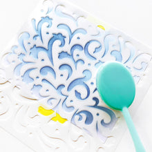 Charger l'image dans la galerie, Catherine Pooler - Stencil - Secret Garden. A celebration of flourishes and blooms, the Secret Garden Stencil has a feel of a wild flower garden. This beautiful, ornate pattern will give your card base so much interest. Try this stencil with a favorite sparkly medium for more texture. Available at Embellish Away located in Bowmanville Ontario Canada.