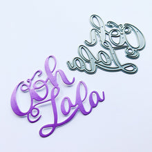 Load image into Gallery viewer, Catherine Pooler - Word Die - Ooh LaLa. Ooh Lala, this word die is divine!! The Ooh Lala is a cute addition to a card celebrating exciting news! It pairs perfectly with our Dreaming of France Stamp Set but will also be a cute focal point for a birthday or a fun way to say congrats. Die measures approx. 2-1/2" x 3". Available at Embellish Away located in Bowmanville Ontario Canada.