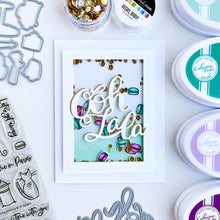 Load image into Gallery viewer, Catherine Pooler - Word Die - Ooh LaLa. Ooh Lala, this word die is divine!! The Ooh Lala is a cute addition to a card celebrating exciting news! It pairs perfectly with our Dreaming of France Stamp Set but will also be a cute focal point for a birthday or a fun way to say congrats. Die measures approx. 2-1/2" x 3". Available at Embellish Away located in Bowmanville Ontario Canada. Card example by Catherine Pooler