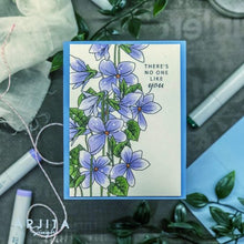 Cargar imagen en el visor de la galería, Gina K. Designs - Stamp & Die Set - Blue Violets. Blue Violet is a stamp set by Arjita Singh. This set is made of premium clear photopolymer and measures 6" X 8". The die set gives you the ability to cut out and layer, creating texture to your creation. Available at Embellish Away located in Bowmanville Ontario Canada. Example by brand ambassador.