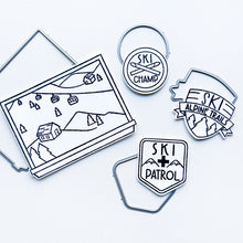 Load image into Gallery viewer, Catherine Pooler - Stamp & Dies - Ski Lodge. The Ski Lodge Stamp Set gives you a view of the mountain along with badges and sentiments for adorable snowy card making! You can also add Alpine View Die for your wintery mix (Sold Separately). Available at Embellish Away located in Bowmanville Ontario Canada.