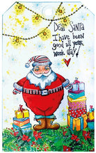 Charger l'image dans la galerie, Studio Light - ABM Clear Stamp - Christmas Dear Santa - Essentials - 148x210x1mm - 1 PC - nr.84. This clear stamp set features Santa Claus, presents, a snowflake and garland. 6 stamps. Size: 5.8x8.3 in. Available at Embellish Away located in Bowmanville Ontario Canada. tag example by brand ambassador.