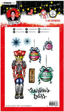 Load image into Gallery viewer, Studio Light - ABM Clear Stamp - Christmas Nutcracker - Essentials - 148x210x1mm - 1 PC - nr.81. This clear stamp set features a Nutcracker, ornaments, snowflakes and also the perfect Christmas and Winter sentiments. 8 stamps. Size: 5.8x8.3 in. Available at Embellish Away located in Bowmanville Ontario Canada.