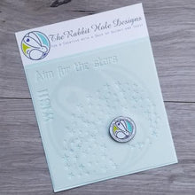 Charger l'image dans la galerie, The Rabbit Hole Designs - 6x6 Stencil - Aim for the Stars. The Rabbit Hole Designs is proud to bring you our Made in the U.S.A 6x6 Stencils that will soon become an essential in your paper crafting and mixed media projects. You can paint, spray, mist, spritz, airbrush, sponge, doodle, mask, and so more! Try them out on card stock, canvas, cork, chipboard, acetate, and fabric.. Available at Embellish Away located in Bowmanville Ontario Canada.