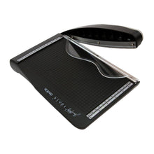 Charger l'image dans la galerie, Tim Holtz - Deckle Cutter 8.5". The Tim Holtz Deckle Torn Edge Trimmer gives your projects the perfect distressed deckle edge effect with maximum control and precision. Designed to provide effortlessly repeatable deckle effects, this new cutting tool from Tim Holtz and Tonic Studios is essential for any crafter looking to bring life to their next design. Available at Embellish Away located in Bowmanville Ontario Canada.