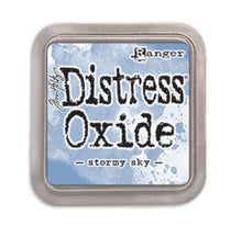 Load image into Gallery viewer, Tim Holtz - Distress Oxide Pad - Large. Create an aged look on papers, fibers, photos and more! This package contains one 2-1/4x2-1/4 inch ink pad. Comes in a variety of distressed colors. Each sold separately. Available at Embellish Away located in Bowmanville Ontario Canada. Stormy Sky