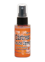 Load image into Gallery viewer, Tim Holtz - Distress Oxide Spray. Creates oxidized effects when sprayed with water. Use for quick and easy ink coverage on porous surfaces. Spray through stencils, layer colors, spritz with water and watch the color mix and blend. Available at Embellish Away located in Bowmanville Ontario Canada. Carved Pumpkin
